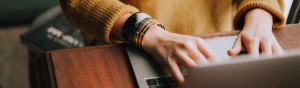 Photo of a person working on their laptop